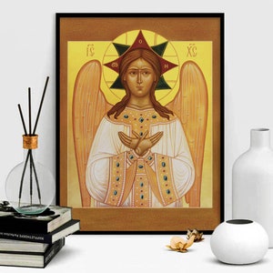 May include: A religious icon depicting an angel with golden wings and a halo. The angel is wearing a white robe with gold trim and has a serene expression. The icon is painted in a traditional style with vibrant colours.