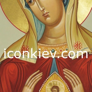 May include: A religious icon painting of the Virgin Mary holding a small image of baby Jesus in her hands. The icon is painted in a traditional style with gold accents and a red background. The text "iconkiev.com" is visible in the lower center of the image.
