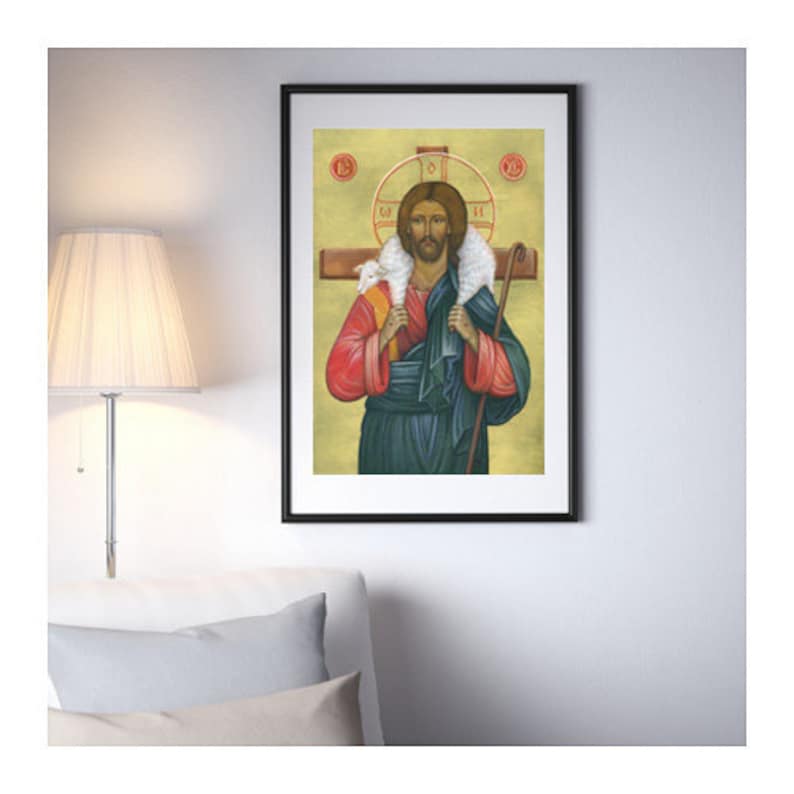 May include: A religious icon painting of Jesus Christ as the Good Shepherd. He is depicted with a lamb on his shoulders and a staff in his hand. The background is a yellow-gold colour with a halo around Jesus' head.