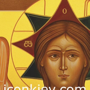 May include: A religious icon painting depicting a woman with brown hair and a gold halo. She is wearing a white robe and has a serious expression. The icon is painted in a traditional style with a gold background and a red and green star.