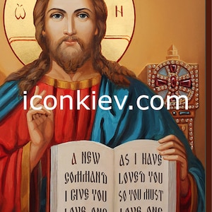 May include: A religious icon painting of Jesus Christ holding an open book with the text "A NEW COMMAND I GIVE YOU LOVE ONE ANOTHER AS I HAVE LOVED YOU SO YOU MUST LOVE ONE ANOTHER".