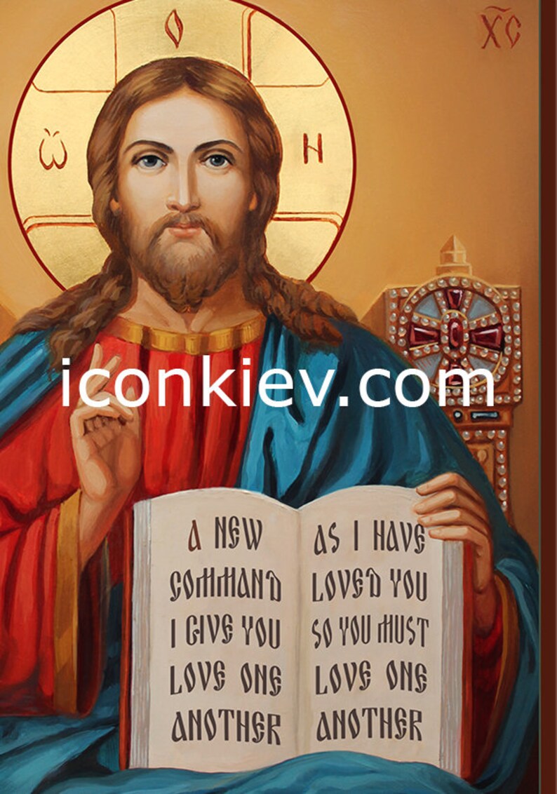 May include: A religious icon painting of Jesus Christ holding an open book with the text "A NEW COMMAND I GIVE YOU LOVE ONE ANOTHER AS I HAVE LOVED YOU SO YOU MUST LOVE ONE ANOTHER".