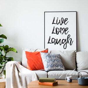 May include: A white ceramic mug with a black handle and the text "But First, Coffee" in a black, bold font. The mug is on a white surface. The mug is 10 cm tall.