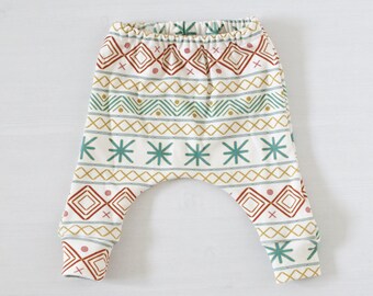 Baby harem pants. Geometric pattern from organic cotton. Waistband ochre yellow. Comfortable harem legging. Toddler style. Unisex