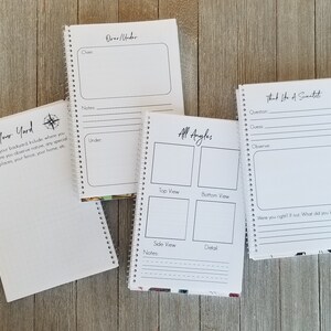 May include: Four spiral-bound notebooks with white pages and black text. The notebooks have prompts like "Map Your Yard", "Over/Under", "All Angles", and "Think Like A Scientist". The notebooks are on a wooden surface.
