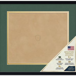 May include: A black wooden shadowbox frame featuring a dark green mat with a metallic gold accent border and a soft tan suede backing. A corner label displays the text Military Medals Shadowbox, Premium Medal Display, Metallic Gold Accent Mat, Soft Suede Backing, Holds Multiple Awards & Medals, Solid Wood Construction, and Honor Commitment Devotion.