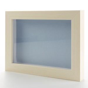 May include: A light wood picture frame with a white mat and a clear glass front.