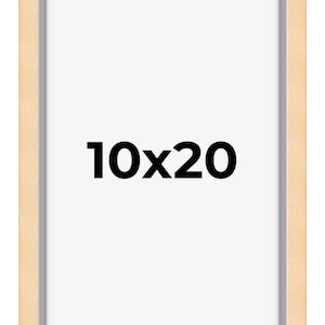 May include: A natural wood picture frame with a light wood finish and a white mat. The frame is 10 inches by 20 inches.