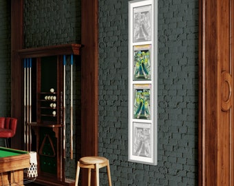 May include: A white picture frame with four images inside. The images are of a person in a green and yellow costume. The frame is mounted on a dark gray brick wall.