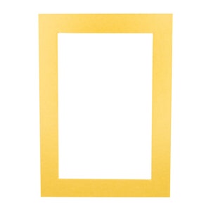 May include: A yellow picture frame with a white mat.