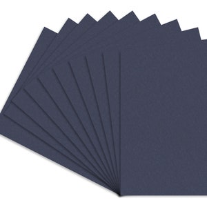 May include: A stack of 12 dark blue cardstock sheets.