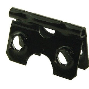 May include: Black metal hinge with two holes on each side. The hinge is folded in half and has a smooth, shiny finish.