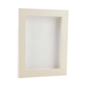 May include: A white wooden picture frame with a white mat.