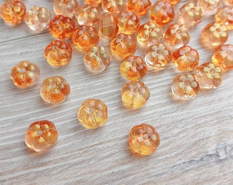 10 stuks glaskralen pompoen 10 mm oranje transparant met glitterrondel