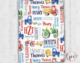 May include: A white baby blanket with a repeating pattern of red, blue, and green tractors, trucks, and airplanes. The name "Henry Thomas" is repeated throughout the pattern in various colors and fonts.