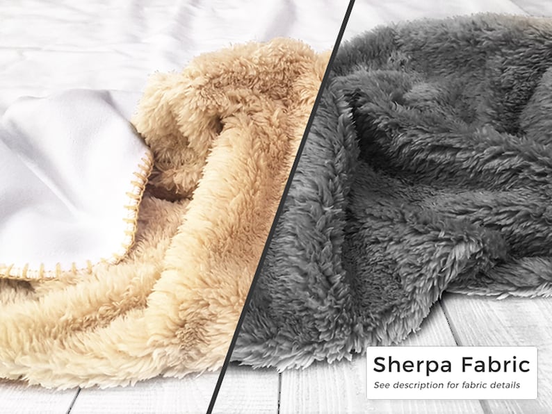 May include: A close-up of a blanket with three distinct textures and colors. The blanket features a white, smooth fabric, a tan, fluffy sherpa, and a gray, fluffy sherpa. The text "Sherpa Fabric" is visible.