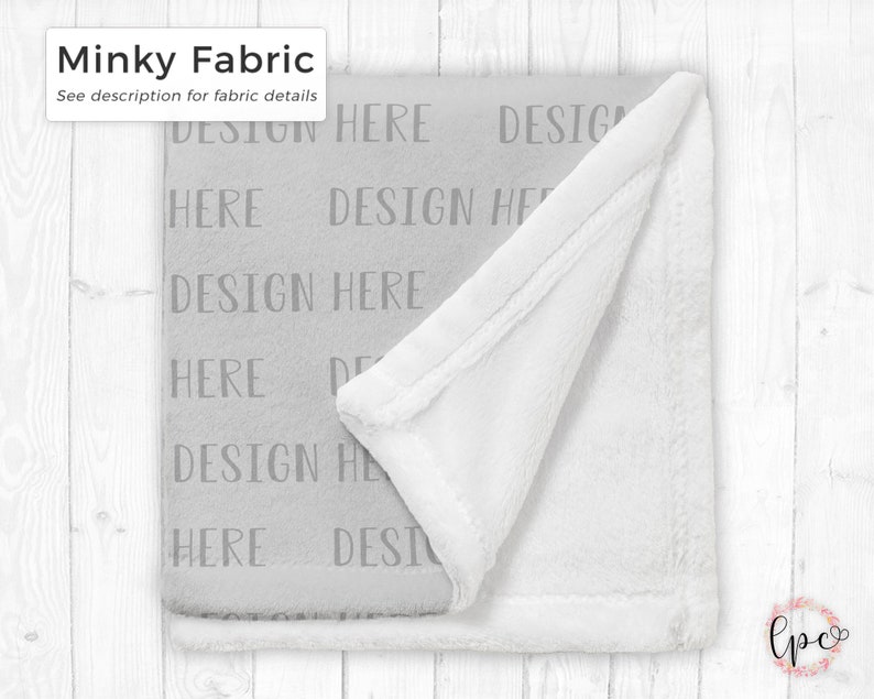 May include: A soft, gray minky fabric blanket with the text "DESIGN HERE" repeated across the surface. The blanket has a white, plush underside and a white border. The text "Minky Fabric" is in the upper left corner.