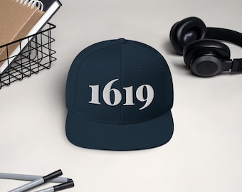 May include: A navy blue baseball cap with a white embroidered "1619" on the front.