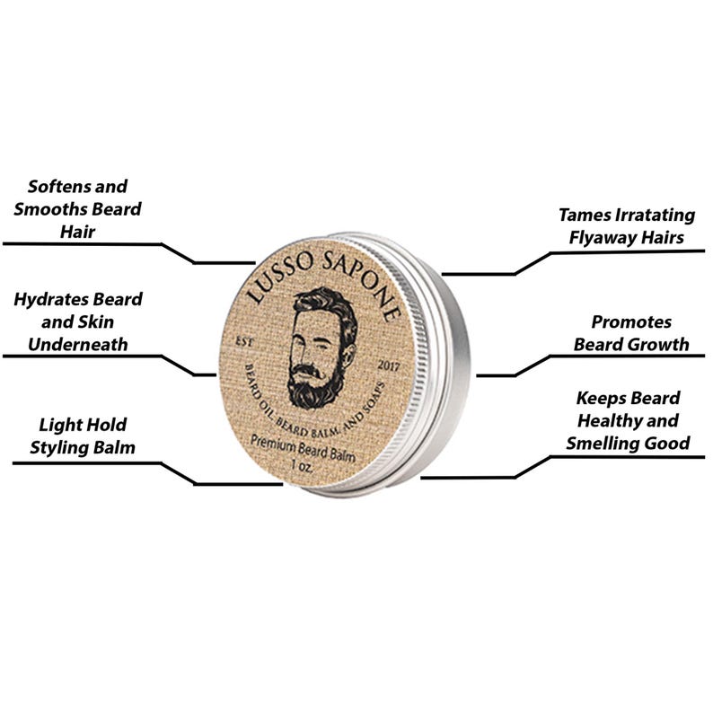May include: A silver tin of beard balm with a brown label featuring a bearded man's face and the text "Lusso Sapone Est 2017 Beard Oil Beard Balm and Soaps Premium Beard Balm 1 oz".