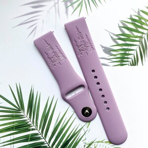 May include: Two lilac purple silicone watch bands with an embossed tree design.