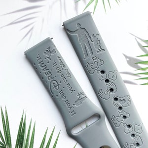 May include: Grey silicone watch strap with a Disney theme. One side features the text "If you can dream it, you can do it." with a Disney castle and stars. The other side features Mickey Mouse and other Disney characters.