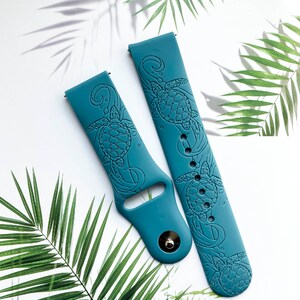 May include: Two teal blue silicone watch bands with a sea turtle design. The bands are made of soft, flexible silicone and feature a detailed sea turtle design.