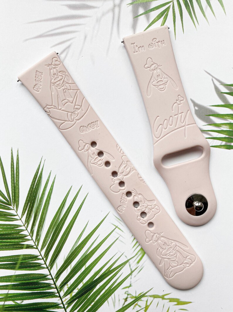 May include: Two pink silicone watch bands with a Goofy character design. One band has the text "I'm Goofy" and the other has multiple images of Goofy.