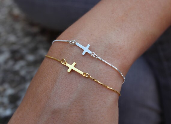 gold bracelet with cross charm