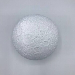 May include: A white, spherical moon lamp with a textured surface that resembles the surface of the moon.