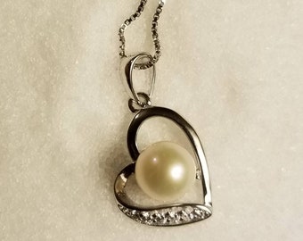925 sterling silver pearl floating heart with crystals.(chain included)