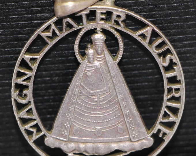 Beautifully Carved from an Austrian 5 Schilling 1934 coin to show image of the Virgin Mary.