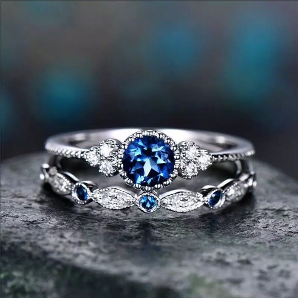 Wedding ring with blue best sale stone