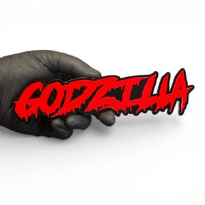 May include: A red and black Godzilla logo. The word "GODZILLA" is written in a bold, dripping font. The logo is held by a gloved hand against a white background.