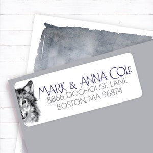 May include: A white return address label with a gray wolf illustration on the left side. The text reads "Mark & Anna Cole, 8866 Doghouse Lane, Boston, MA 96874".