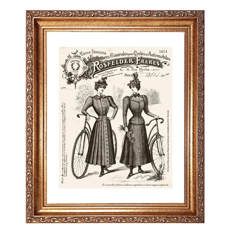 May include: Framed vintage print featuring two women in period clothing posing with bicycles. The print has a sepia tone and includes French text, with the words "ROSFELDER FRERES" prominently displayed. The frame is ornate and gold-colored.