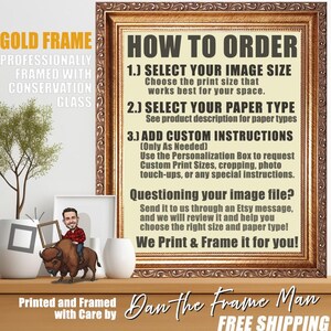 May include: A framed print with a gold frame, featuring instructions on how to order. The text includes steps for selecting image size, paper type, and adding custom instructions. A small decorative figurine is on the wooden surface.