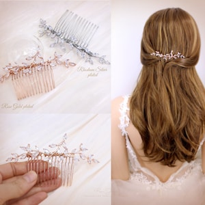 May include: A set of three bridal hair combs with crystal embellishments in the shape of leaves. The combs are available in rose gold, rhodium silver, and silver.