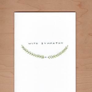 front of card: handwritten "with sympathy" about soft green illustrated branches.