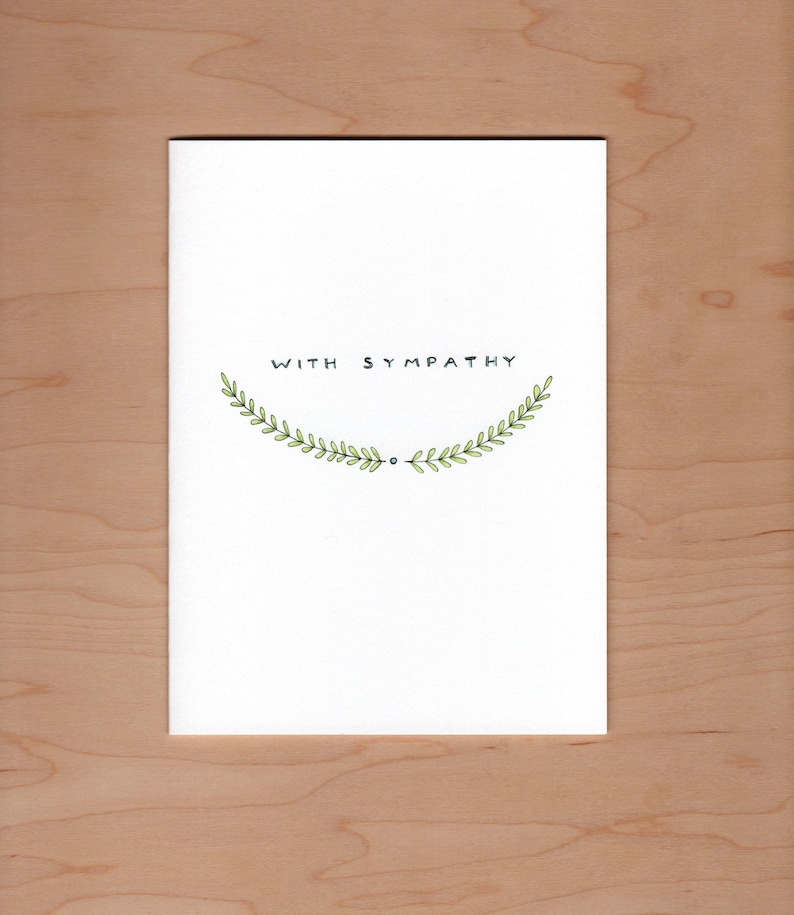 front of card: handwritten "with sympathy" about soft green illustrated branches.