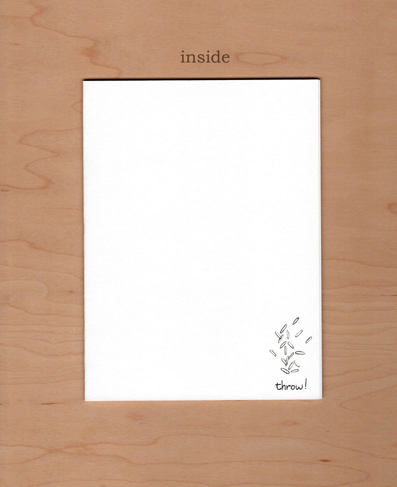 May include: A white card with a black and white illustration of rice being thrown in the air. The text "throw!" is written below the illustration.