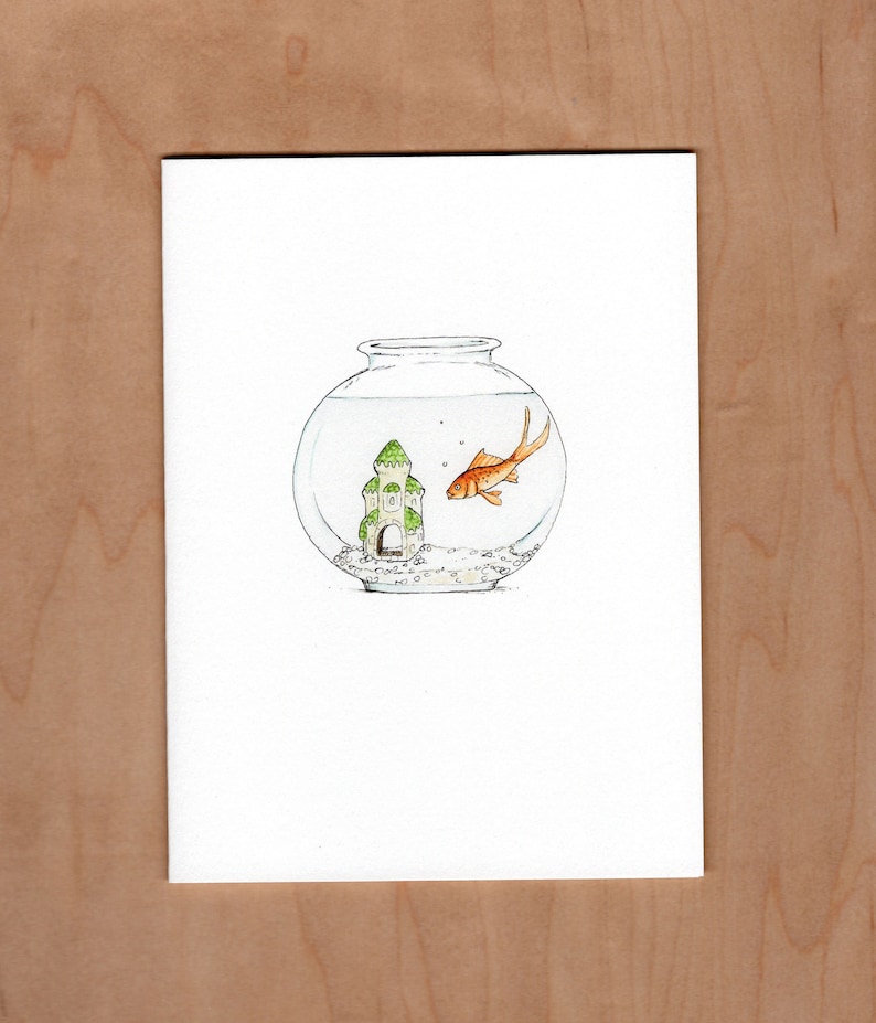 front of card: illustration of a fish bowl with a goldfish looking at a little ceramic castle in their bowl