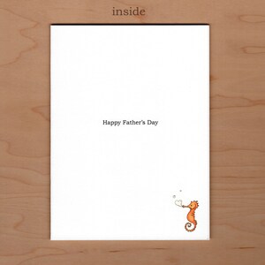 May include: A white card with the text "Happy Father's Day" and a cartoon orange seahorse blowing a heart-shaped bubble.