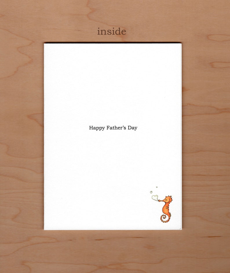 May include: A white card with the text "Happy Father's Day" and a cartoon orange seahorse blowing a heart-shaped bubble.