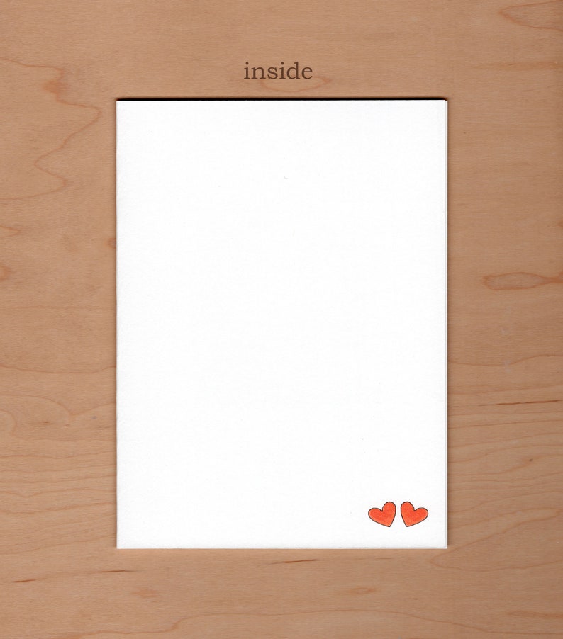 no message inside the card.  Illustration of two small red heart are in the bottom right corner
