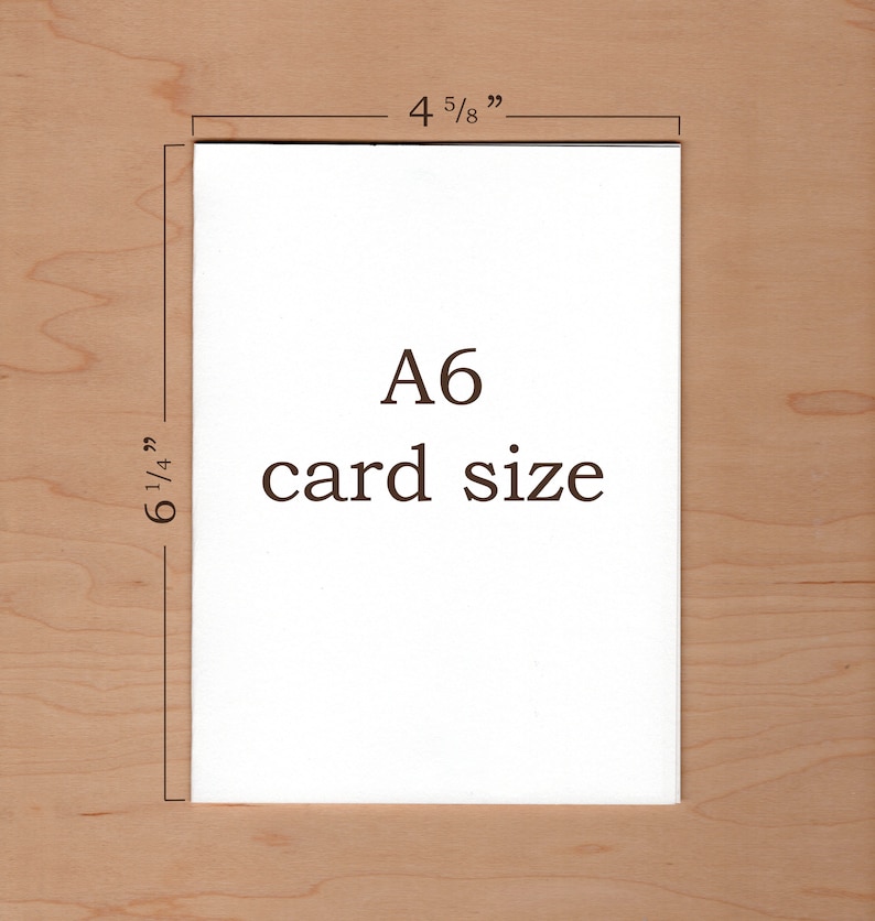 May include: A white card with the text "A6 card size" and measurements of 4 5/8 inches by 6 1/4 inches.