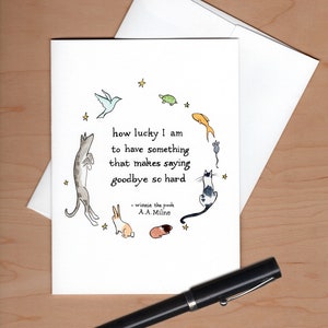 Card with envelope askew behind and a black  fountain pen below for scale