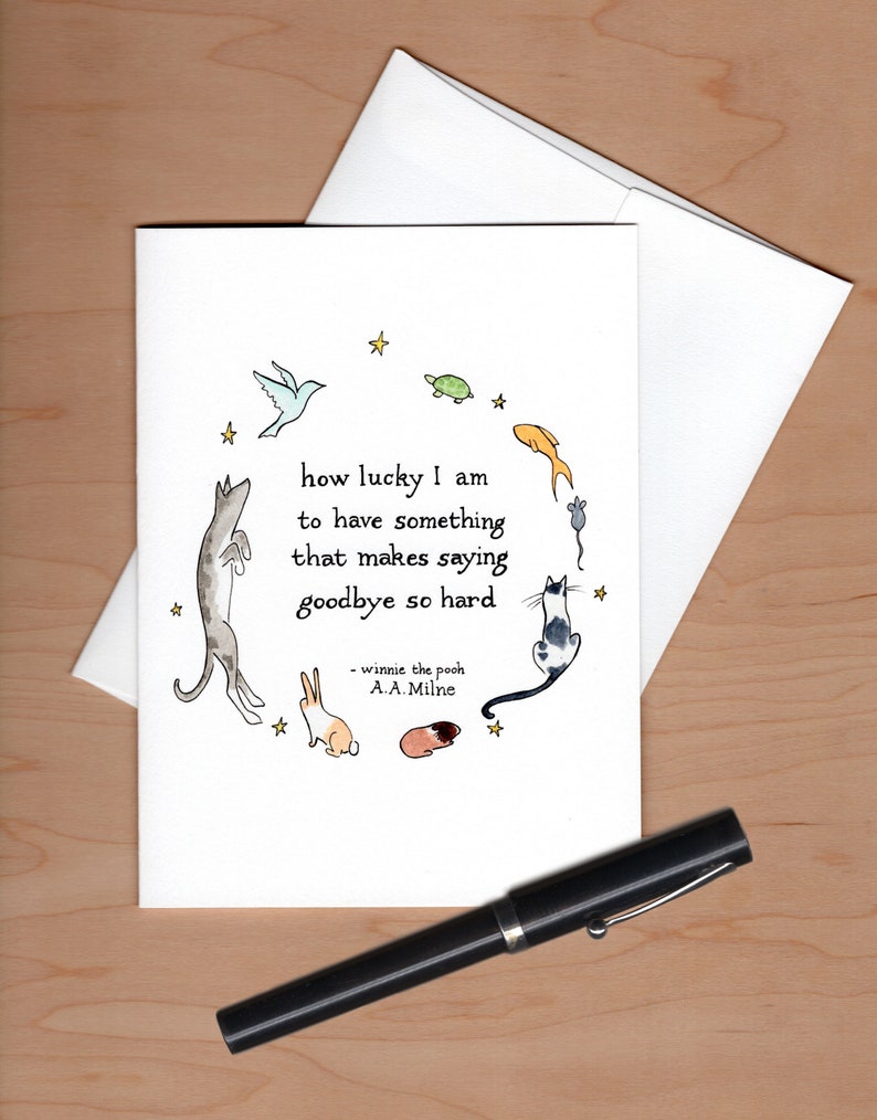 Card with envelope askew behind and a black  fountain pen below for scale