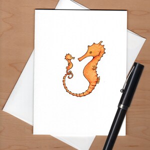 May include: A hand-drawn illustration of two orange seahorses. The larger seahorse is on the right and the smaller seahorse is on the left. The seahorses are facing each other.