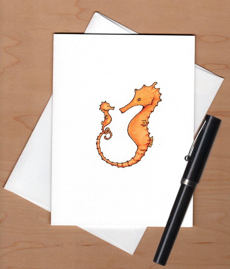 May include: A hand-drawn illustration of two orange seahorses. The larger seahorse is on the right and the smaller seahorse is on the left. The seahorses are facing each other.