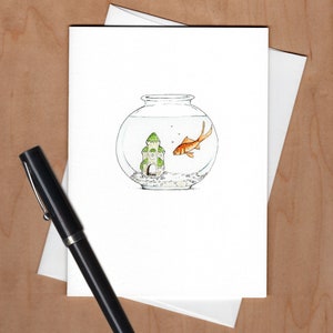 May include: A watercolor illustration of a goldfish swimming in a round glass bowl with a small green castle inside. The bowl is on a white background.